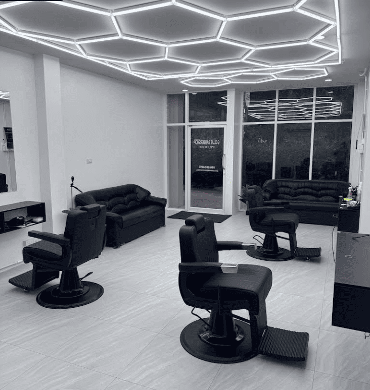 The interior of G club barber, well lit, clean, minimalistic.