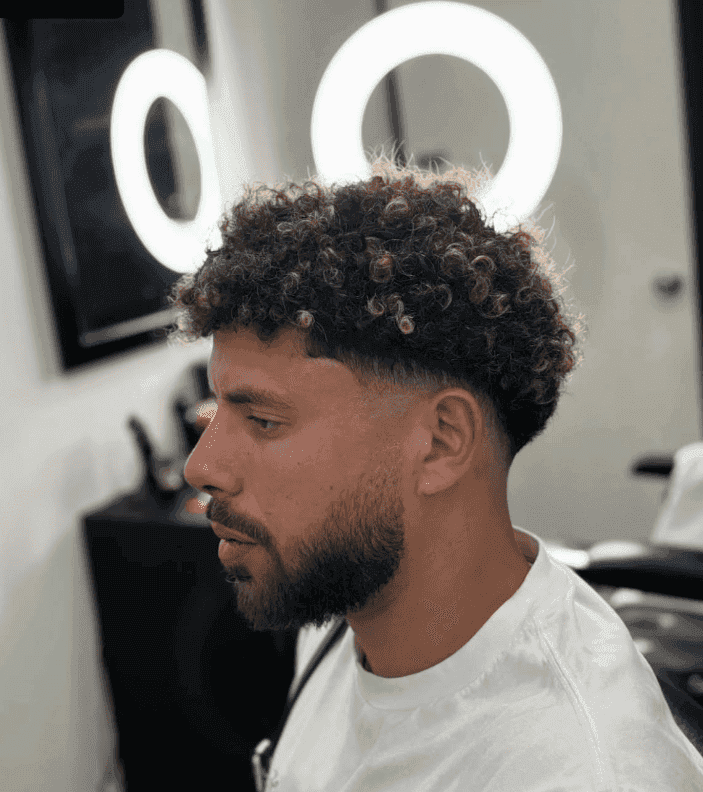 A client from G club barbershop with a curly top